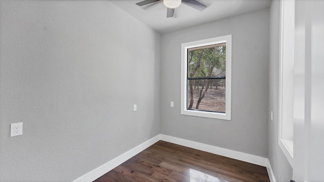 725 Winding Vw, New Braunfels, TX 78132 - empty room with a ceiling fan, dark wood finished floors, and baseboards