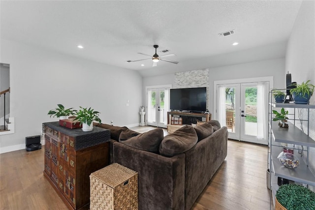 725 Winding Vw, New Braunfels, TX 78132 - living area featuring visible vents, french doors, baseboards, wood finished floors, and a ceiling fan