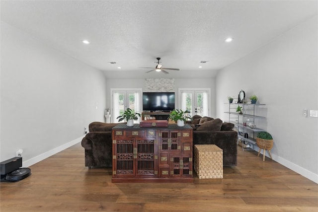 725 Winding Vw, New Braunfels, TX 78132 - living room with a ceiling fan, wood finished floors, french doors, and baseboards