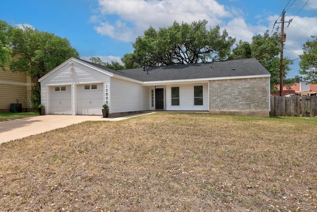 12808 Silver Creek Dr, Austin, TX 78727 - ranch-style house with brick siding, an attached garage, and driveway