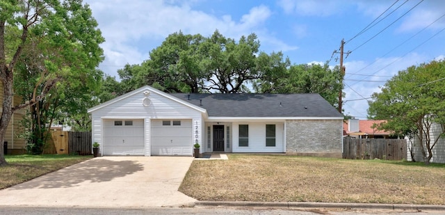 12808 Silver Creek Dr, Austin, TX 78727 - ranch-style house with a garage, driveway, and brick siding