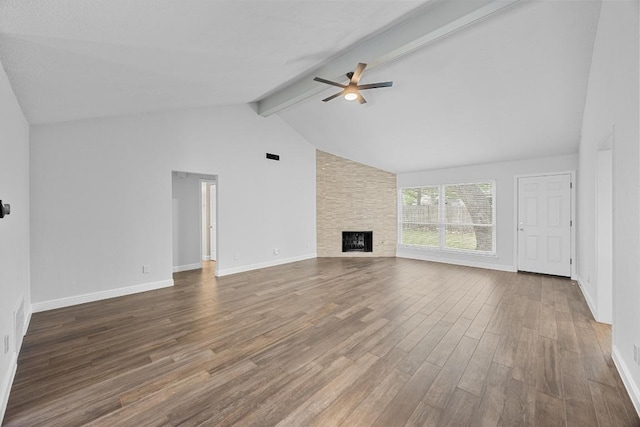 12808 Silver Creek Dr, Austin, TX 78727 - unfurnished living room featuring a ceiling fan, wood finished floors, and a large fireplace