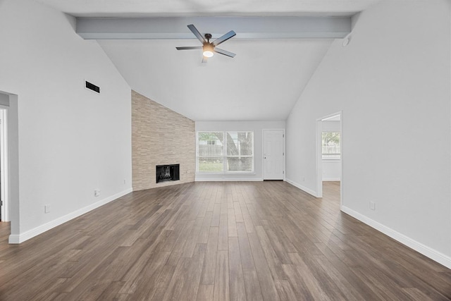 12808 Silver Creek Dr, Austin, TX 78727 - unfurnished living room with high vaulted ceiling, beam ceiling, ceiling fan, plenty of natural light, and dark wood finished floors