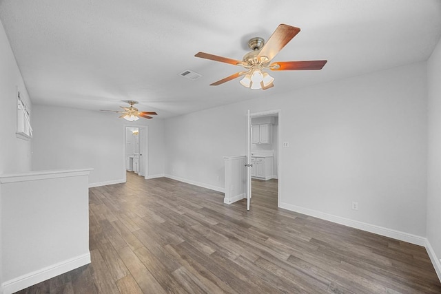 12808 Silver Creek Dr, Austin, TX 78727 - unfurnished living room featuring a ceiling fan and wood finished floors