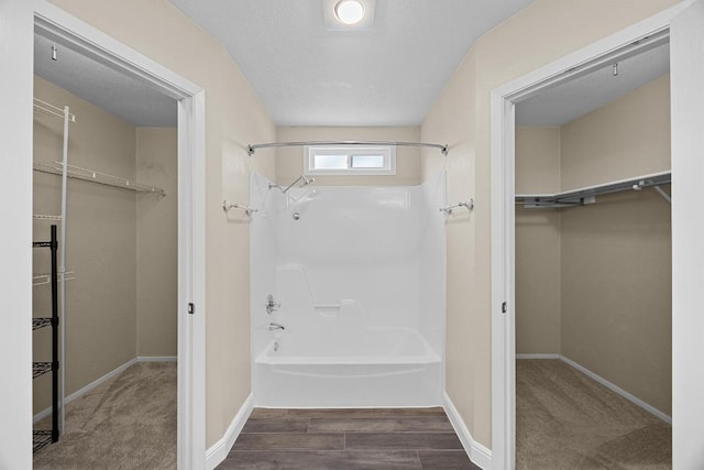 12808 Silver Creek Dr, Austin, TX 78727 - bathroom featuring a walk in closet and bathtub / shower combination