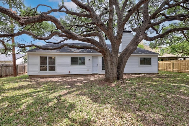 12808 Silver Creek Dr, Austin, TX 78727 - rear view of house with a fenced backyard