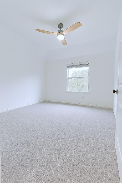 313 El Socorro Ln, Austin, TX 78732 - empty room with a ceiling fan and baseboards