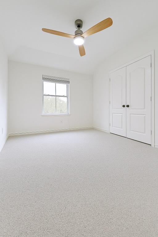 313 El Socorro Ln, Austin, TX 78732 - spare room with ceiling fan, light colored carpet, and baseboards