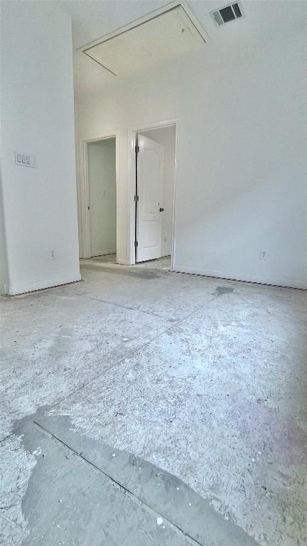 313 El Socorro Ln, Austin, TX 78732 - spare room featuring attic access