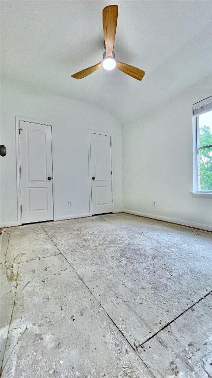 313 El Socorro Ln, Austin, TX 78732 - empty room featuring baseboards and a ceiling fan