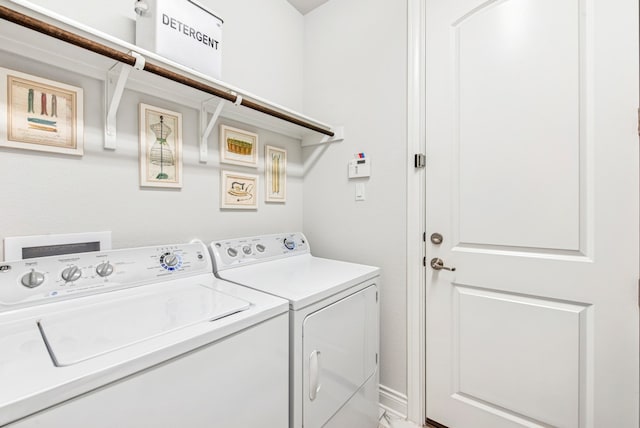 laundry room with washer and dryer and laundry area