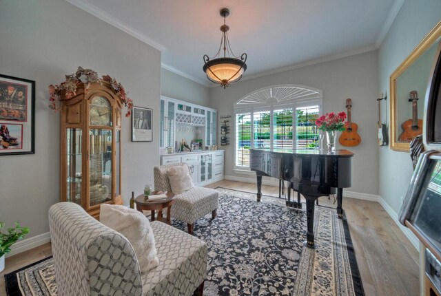 106 Clubhouse Dr, Lakeway, TX 78734 - sitting room featuring wood finished floors and ornamental molding