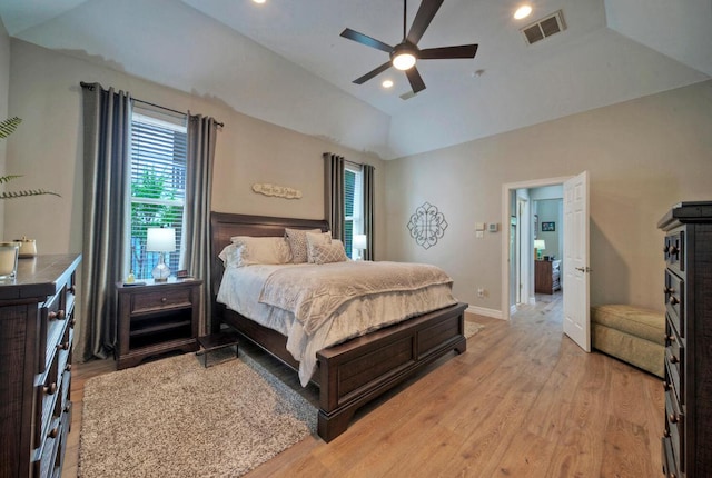 bedroom featuring visible vents, lofted ceiling, light wood-style flooring, and recessed lighting