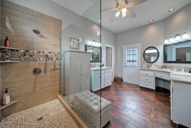 full bath featuring ceiling fan, recessed lighting, a walk in shower, wood finished floors, and vanity