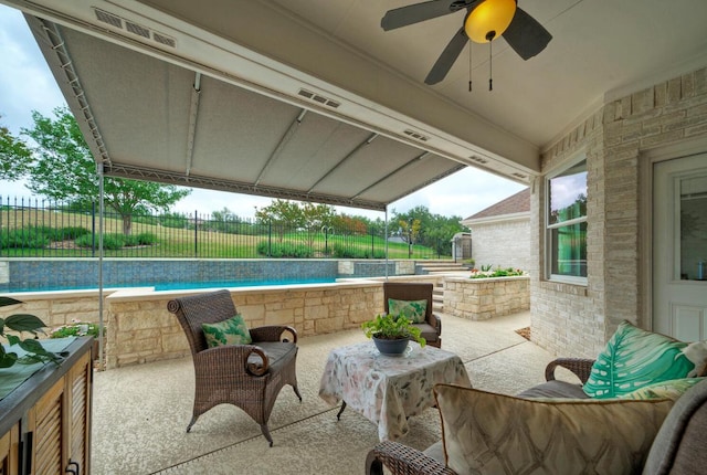view of patio / terrace with fence, visible vents, a ceiling fan, and a fenced in pool