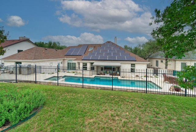 view of swimming pool featuring a lawn, a fenced in pool, and fence private yard