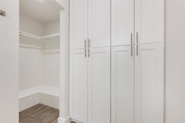 7310 Broken Arrow Ln, Austin, TX 78745 - walk in closet with wood finished floors