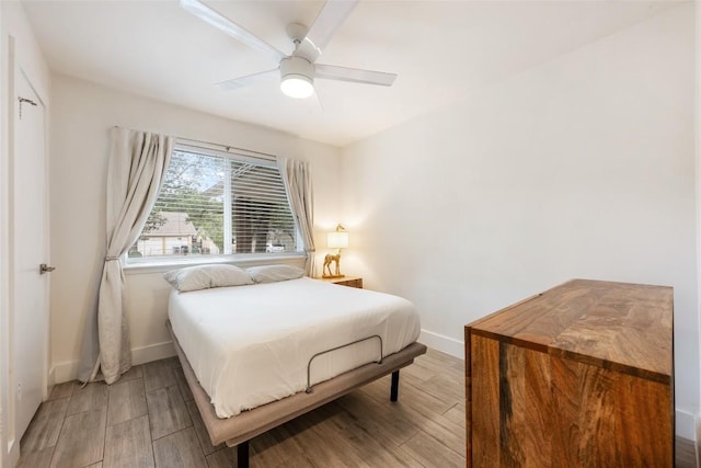 7310 Broken Arrow Ln, Austin, TX 78745 - bedroom featuring ceiling fan, baseboards, and light wood-type flooring