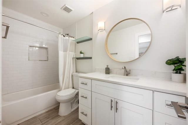 7310 Broken Arrow Ln, Austin, TX 78745 - bathroom featuring shower / bath combo, vanity, toilet, visible vents, and wood finished floors
