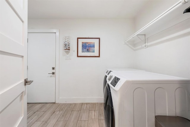 7310 Broken Arrow Ln, Austin, TX 78745 - laundry room with wood finish floors, washer and dryer, and laundry area
