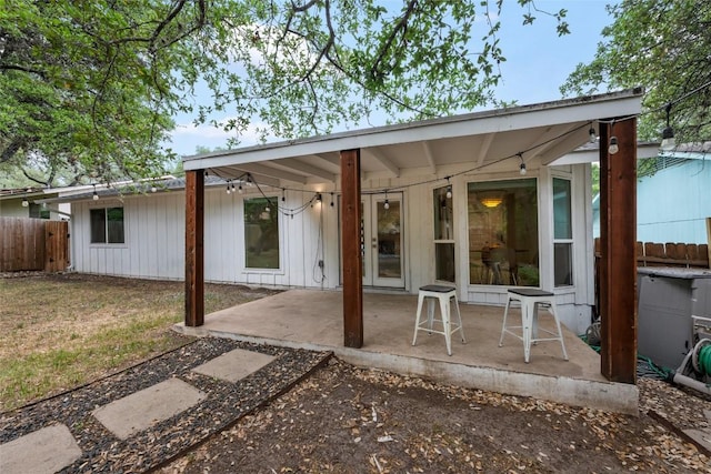 7310 Broken Arrow Ln, Austin, TX 78745 - rear view of property with a patio area and fence