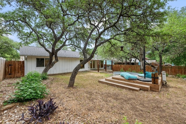 7310 Broken Arrow Ln, Austin, TX 78745 - view of yard with a wooden deck and a fenced backyard