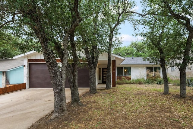 7310 Broken Arrow Ln, Austin, TX 78745 - ranch-style home with driveway, brick siding, and an attached garage