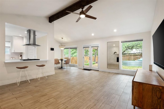 7310 Broken Arrow Ln, Austin, TX 78745 - living area with recessed lighting, vaulted ceiling with beams, light wood-style flooring, ceiling fan, and baseboards