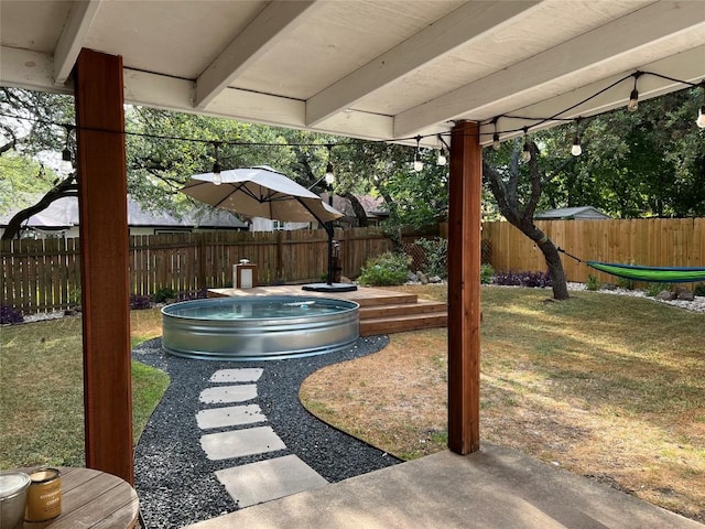 7310 Broken Arrow Ln, Austin, TX 78745 - view of yard featuring a fenced backyard and a patio area