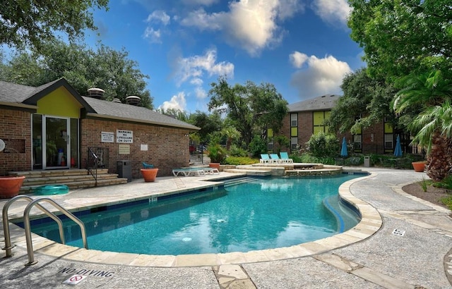 7685 Northcross Dr Unit 304, Austin, TX 78757 - community pool with a patio