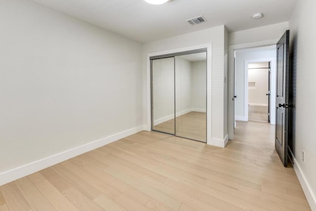 7901 Keswick Dr, Austin, TX 78745 - unfurnished bedroom featuring light wood-style flooring and a closet