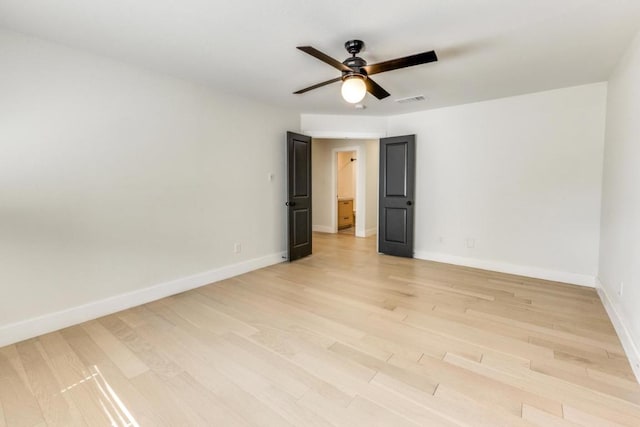 7901 Keswick Dr, Austin, TX 78745 - spare room with ceiling fan, light wood-style flooring, and baseboards