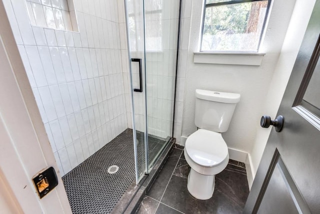 7901 Keswick Dr, Austin, TX 78745 - full bathroom with toilet, a stall shower, tile patterned floors, and baseboards