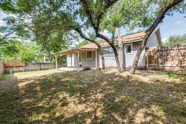 7901 Keswick Dr, Austin, TX 78745 - back of property featuring a patio and a fenced backyard