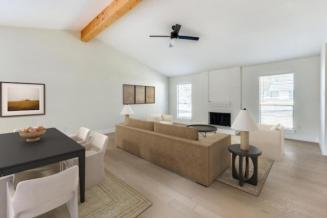 7901 Keswick Dr, Austin, TX 78745 - living area featuring ceiling fan, a brick fireplace, and light wood-style floors