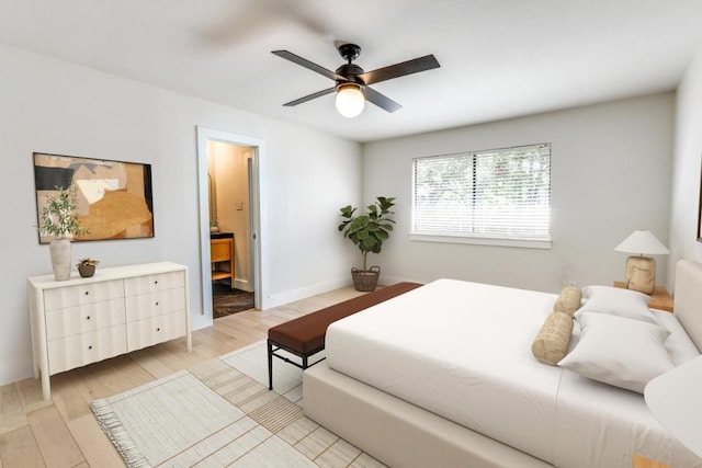 7901 Keswick Dr, Austin, TX 78745 - bedroom with light wood-style flooring, ensuite bath, and a ceiling fan