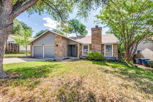 7901 Keswick Dr, Austin, TX 78745 - view of front facade with brick siding, driveway, a garage, and a chimney