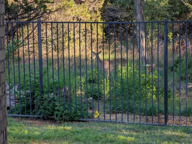 view of gate with fence