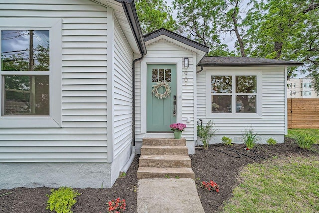 property entrance with fence