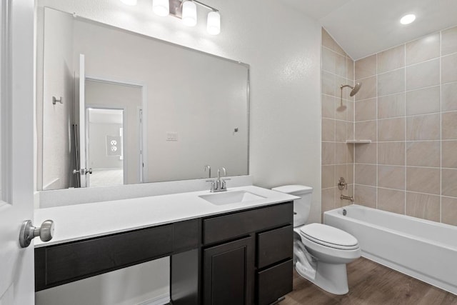 3756 Liberi Ln, Round Rock, TX 78665 - full bathroom with wood finished floors, toilet,  shower combination, vanity, and lofted ceiling