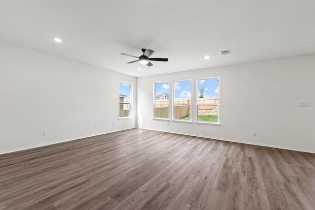 3756 Liberi Ln, Round Rock, TX 78665 - unfurnished room with dark wood-type flooring, a ceiling fan, recessed lighting, and baseboards