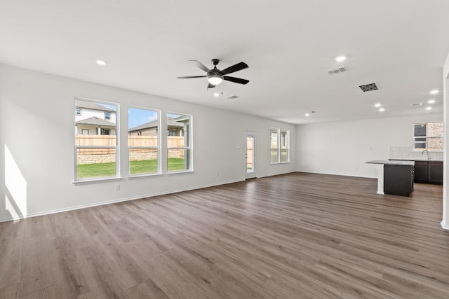 3756 Liberi Ln, Round Rock, TX 78665 - unfurnished living room featuring wood finished floors, recessed lighting, ceiling fan, and baseboards