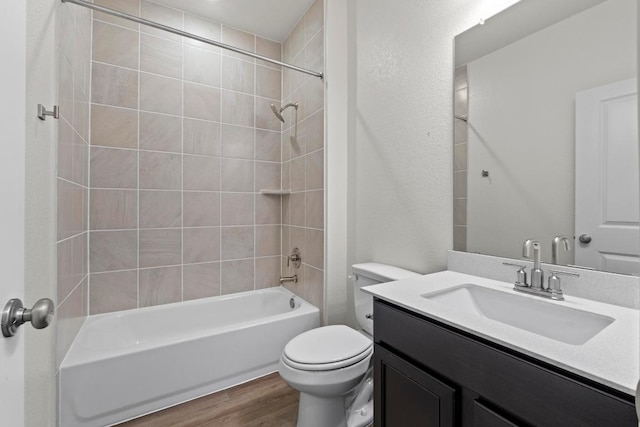 3756 Liberi Ln, Round Rock, TX 78665 - full bathroom with wood finished floors, toilet, bathtub / shower combination, and vanity