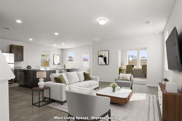 2605 Sam Bass Rd Unit 56, Round Rock, TX 78681 - living room featuring wood finished floors, recessed lighting, and baseboards