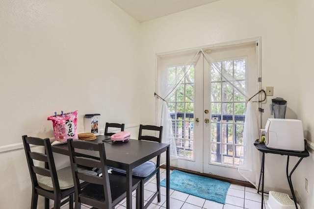 dining room with light tile patterned floors and french doors
