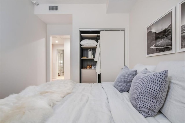 bedroom with recessed lighting, a closet, and visible vents