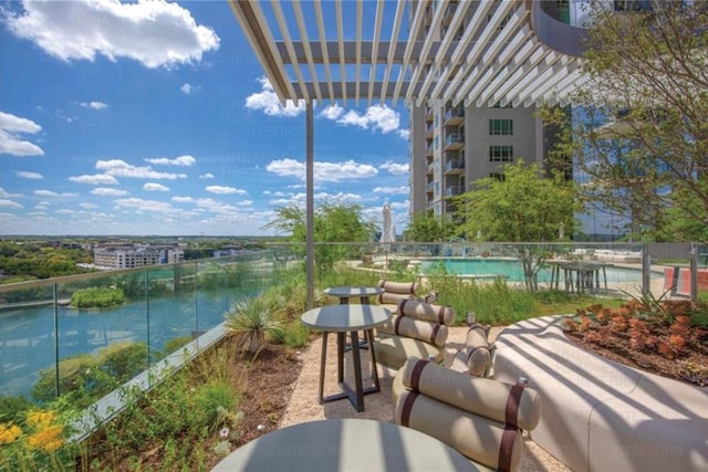 balcony featuring a pergola