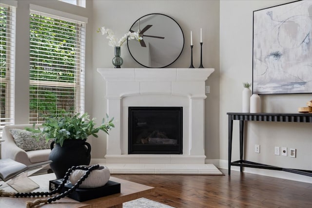 4211 Front Range Ln, Austin, TX 78732 - living room featuring a glass covered fireplace and wood finished floors