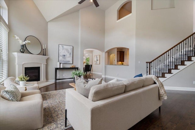 4211 Front Range Ln, Austin, TX 78732 - living area with dark wood-style floors, baseboards, a ceiling fan, and high vaulted ceiling