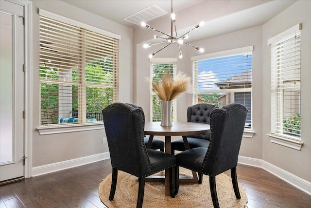 4211 Front Range Ln, Austin, TX 78732 - dining space featuring a notable chandelier, baseboards, hardwood / wood-style flooring, and visible vents